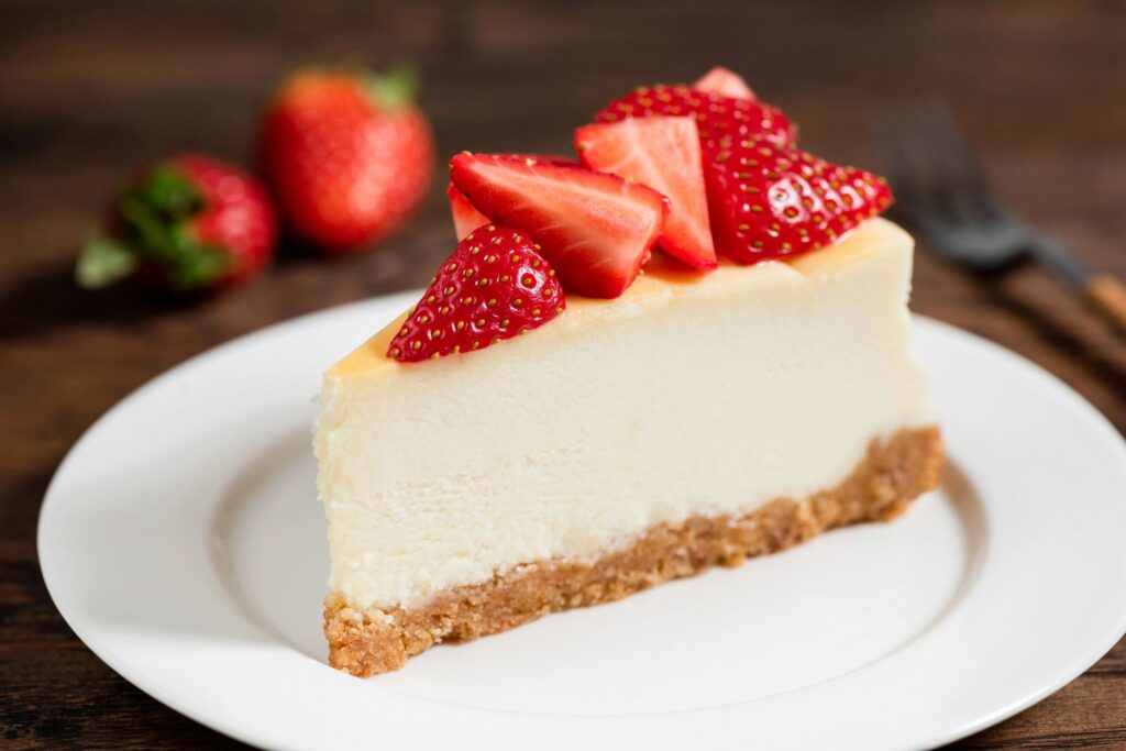 Cheesecake with strawberries on plate