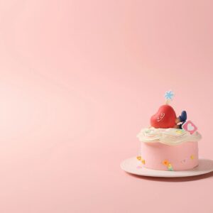 A Small Cream Cake in Pink Background